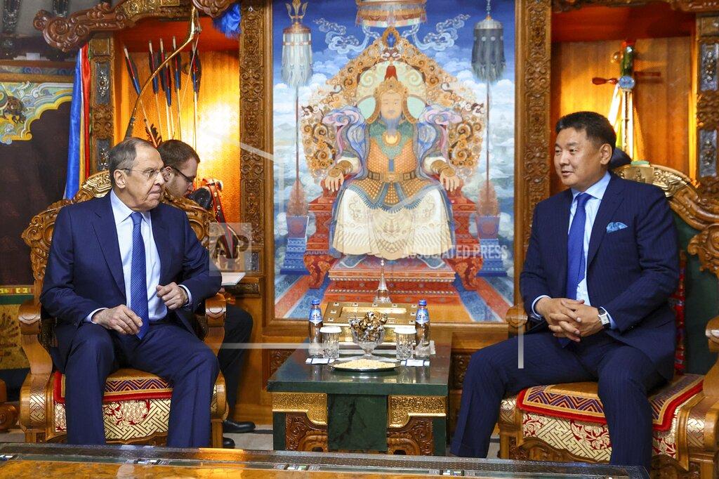 Uncredited In this photo released by Russian Foreign Ministry Press Service, Mongolian President Ukhnaagiin Khurelsukh, right, and Russian Foreign Minister Sergey Lavrov talk during their meeting in Ulaanbaatar, Mongolia, Tuesday, July 5, 2022. (Russian Foreign Ministry Press Service via AP)