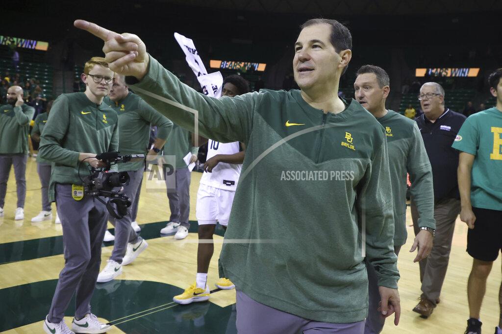 Rod Aydelotte Baylor head coach Scott Drew points to his fans after winning his 400th game after defeating Northern Colorado following an NCAA college basketball game, Monday, Nov. 14, 2022, in Waco, Texas. (AP Photo/Rod Aydelotte)