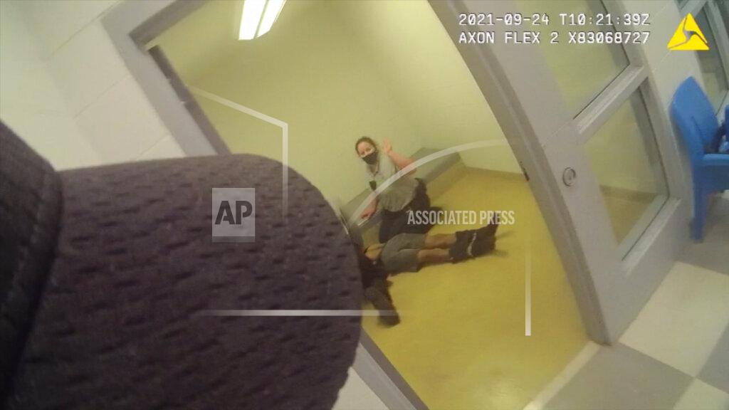 Uncredited In this image from body camera video provided by Sedgwick County, staff members perform CPR on Cedric “C.J.” Lofton, 17, in Wichita, Kan., on Sept. 24, 2021. The final autopsy, released in December, listed C.J.'s cause of death as “complications of cardiopulmonary arrest sustained after physical struggle while restrained in the prone position.” The death was declared a homicide. (Sedgwick County via AP)