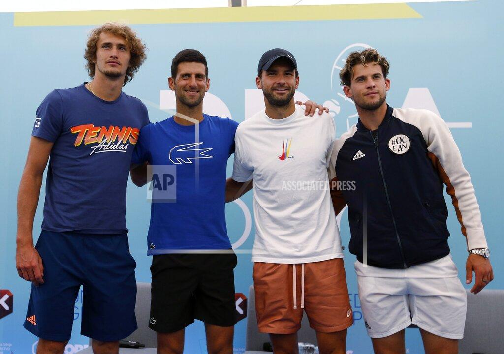 Darko Vojinovic FILE - In this Friday June 12, 2020 file photo Serbia's Novak Djokovic, second left, poses with Germany's Alexander Zverev, left, Bulgaria's Grigor Dimitrov, second right, and Austria's Dominic Thiem after a press conference prior a a charity tournament Adria Tour, in Belgrade, Serbia. Novak Djokovic has tested positive for the coronavirus after taking part in a tennis exhibition series he organized in Serbia and Croatia. Grigor Dimitrov, a three-time Grand Slam semifinalist from Bulgaria, said Sunday he tested positive. (AP Photo/Darko Vojinovic)