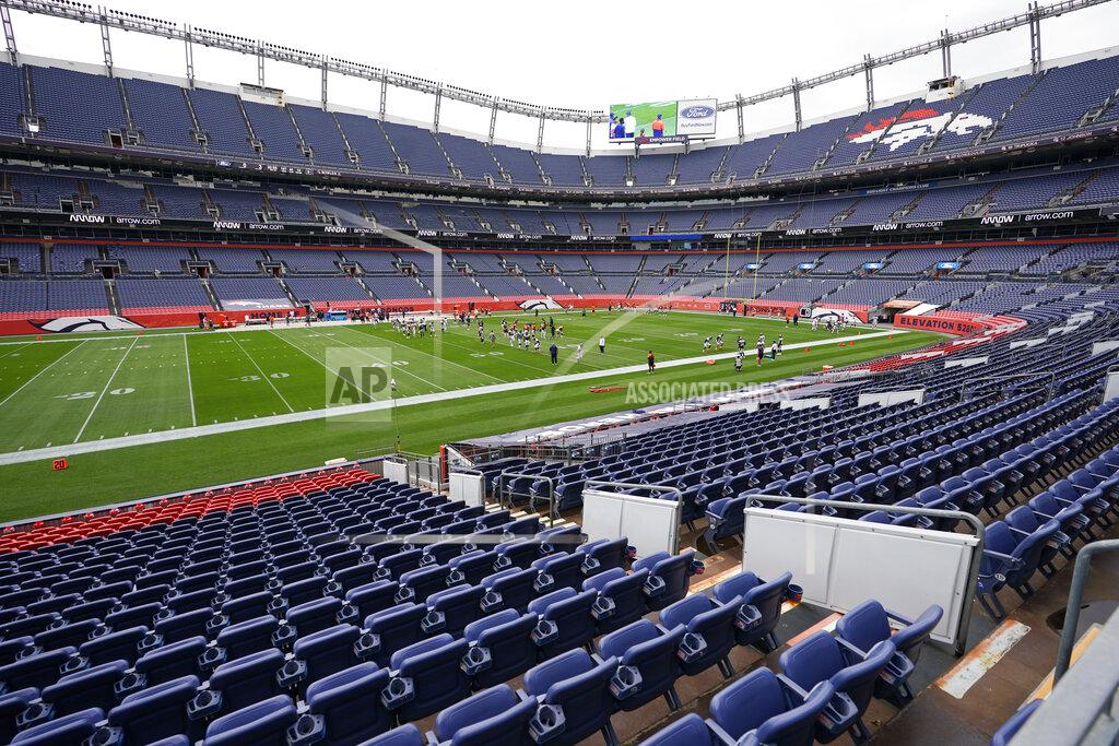 Members of the Denver Broncos take part in drills during an NFL football practice in empty Empower Field at Mile High, Saturday, Aug. 29, 2020, in Denver. (AP Photo/David Zalubowski)