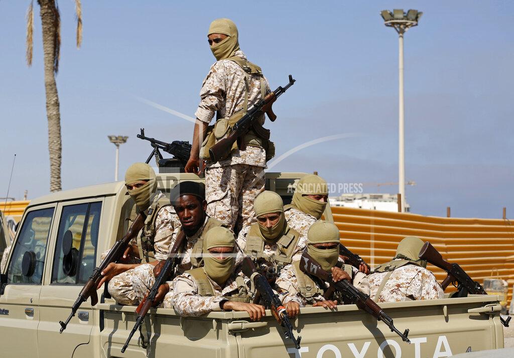Yousef Murad Forces loyal to Abdul Hamid Dbeibah, one of Libya’s two rival prime ministers, secure the streets of the capital, Tripoli, Tuesday May, 17, 2022. Clashes broke out in Tripoli after Dbeibah’s rival, Prime Minister Fathi Bashagha, announced his arrival in the city on Tuesday morning. But Bashagha left soon after the fighting started. (AP Photo/Yousef Murad)