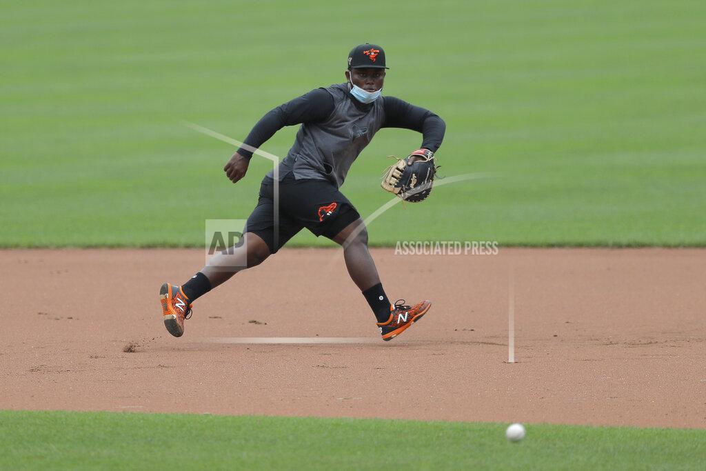 Julio Cortez Baltimore Orioles infielder Dilson Herrera fields a ground ball during baseball training camp, Tuesday, July 7, 2020, in Baltimore. (AP Photo/Julio Cortez)