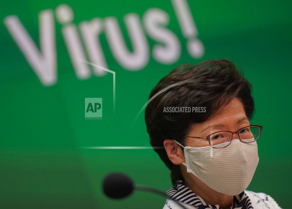 Vincent Yu Hong Kong Chief Executive Carrie Lam listens to journalists questions during a press conference in Hong Kong, Monday, July 13, 2020. Hong Kong on Monday introduced more stringent social-distancing measures, banning public gatherings of more than four and making it compulsory to wear a mask on public transport as the city battles a fresh outbreak of locally-transmitted coronavirus infections. (AP Photo/Wally Santana)
