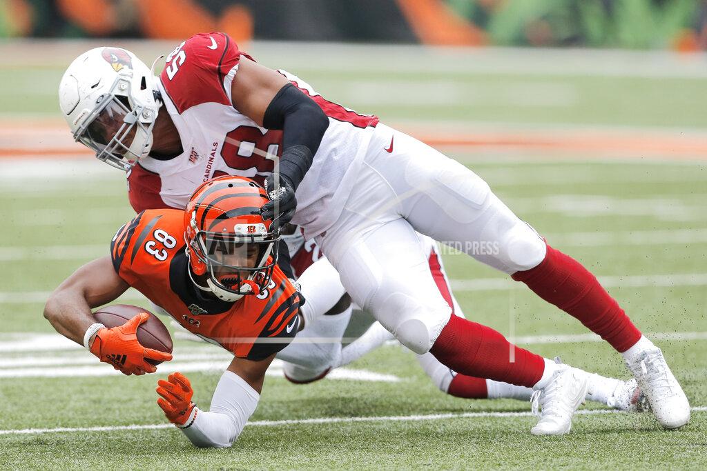 Gary Landers Cincinnati Bengals wide receiver Tyler Boyd (83) is tackled by Arizona Cardinals middle linebacker Jordan Hicks (58) in the second half of an NFL football game, Sunday, Oct. 6, 2019, in Cincinnati. (AP Photo/Gary Landers)