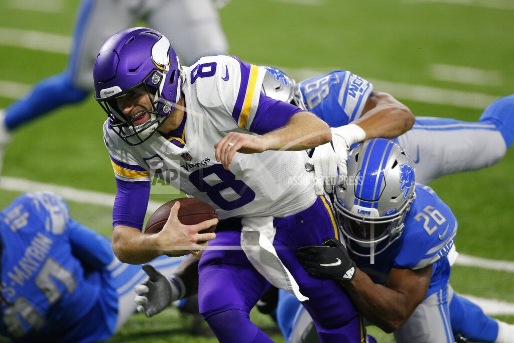 Al Godlis Minnesota Vikings quarterback Kirk Cousins (8) is sacked by Detroit Lions strong safety Duron Harmon (26) during the second half of an NFL football game , Sunday, Jan. 3, 2021, in Detroit. (AP Photo/Al Goldis)