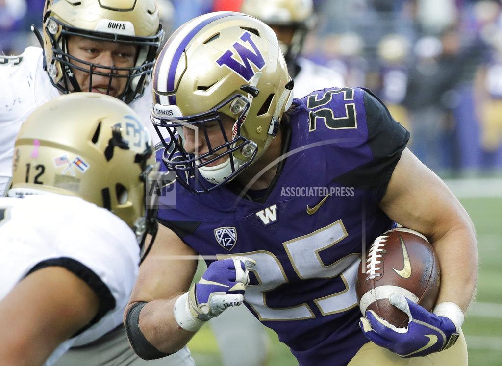 Ted S. Warren Washington linebacker Ben Burr-Kirven (25) runs after he intercepted a pass thrown by Colorado quarterback Steven Montez (12) during the second half of an NCAA college football game, Saturday, Oct. 20, 2018, in Seattle. Washington won 27-13. (AP Photo/Ted S. Warren)