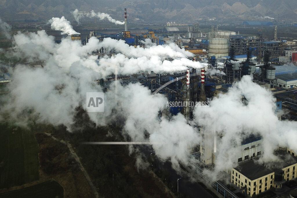Sam Mcneil FILE - In this Nov. 28, 2019, file photo, smoke and steam rise from a coal processing plant in Hejin in central China's Shanxi Province. As Americans celebrate or fume over the new president-elect, many in Asia are waking up to the reality of a Joe Biden administration with decidedly mixed feelings. Relief and hopes of economic and environmental revival jostle with needling anxiety and fears of inattention. There’s hope in Tokyo that Biden’s more progressive ecological policies will help Japanese green companies and that he will take a hard line on China, with which Japan is in constant competition. (AP Photo/Sam McNeil, File)