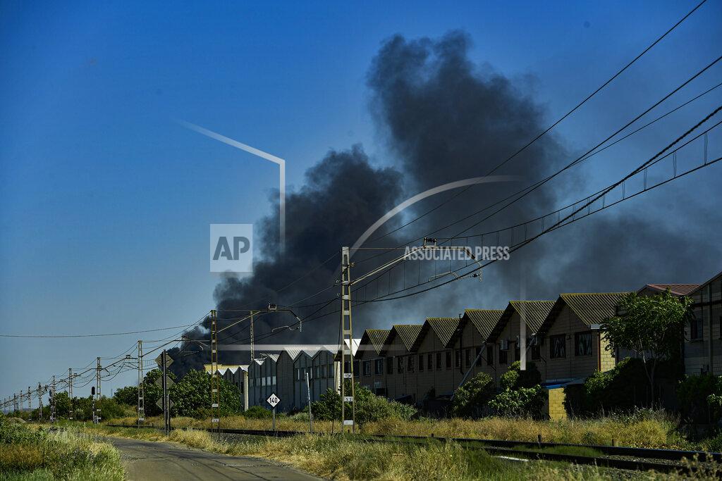 Alvaro Barrientos Black smoke billows from a biodiesel production plant in Calahorra, northern Spain, Thursday, May 26, 2022. Police in Spain say an explosion at a biodiesel plant has left two people dead and forced 250 children to be evacuated from the area. (AP Photo/Alvaro Barrientos)