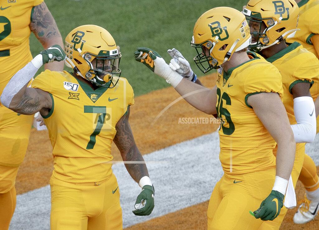 Nick Wagner Baylor running back John Lovett (7) celebrates a touchdown against Texas during an NCAA college football game on Saturday, Nov. 23, 2019, in Waco, Texas. (Nick Wagner/Austin American-Statesman via AP)