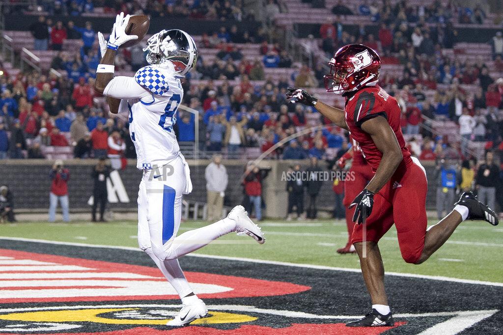 Bryan Woolston FILE - In this Nov. 24, 2018, file photo, Kentucky wide receiver Josh Ali (82) catches a touchdown pass during the team's NCAA college football game against Louisville in Louisville, Ky. The Southeastern Conference's conference-only scheduling decision during the coronavirus pandemic wiped out any hopes of saving four in-state rivalries against Atlantic Coast Conference opponents, all traditionally played on the final Saturday of the regular season. (AP Photo/Bryan Woolston, File)