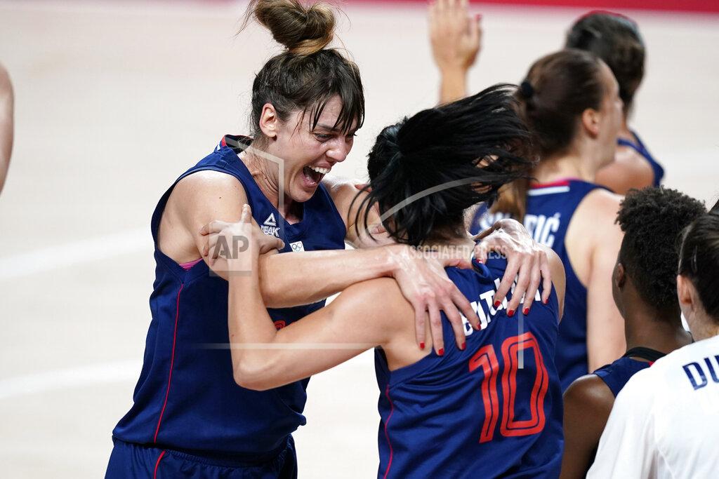 Charlie Neibergall Serbia's Tina Krajisnik celebrates with teammate Dajana Butulija (10) at the end of a women's basketball quarterfinal round game against China at the 2020 Summer Olympics, Wednesday, Aug. 4, 2021, in Saitama, Japan. (AP Photo/Charlie Neibergall)