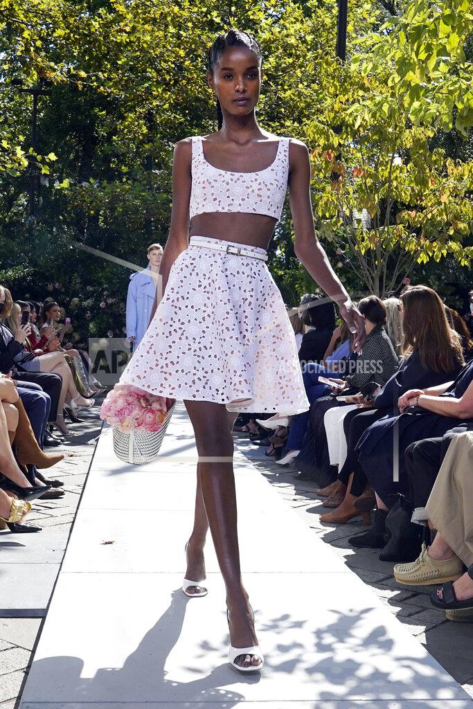 Richard Drew The Michael Kors Spring/Summer 2022 collection is modeled during Fashion Week, in New York, Friday, Sept. 10, 2021. (AP Photo/Richard Drew)