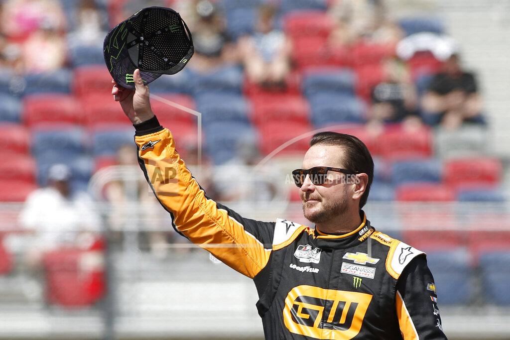 Ralph Freso FILE - In this Sunday, March 8, 2020, file photo, Kurt Busch waves to fans during driver introductions prior to the NASCAR Cup Series auto race at Phoenix Raceway, in Avondale, Ariz. Busch has welcomed the uncertainty of this season as he chases a playoff berth while pondering his future in NASCAR. Busch posted the fastest practice time Saturday, July 3, 2021, as NASCAR’s Cup Series returned to Road America for the first time since 1956. (AP Photo/Ralph Freso, File)