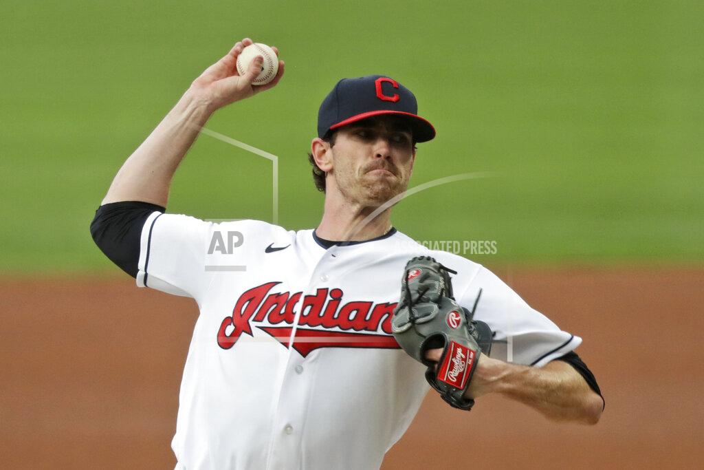 FILE - Cleveland Indians starting pitcher Shane Bieber delivers in the first inning in a baseball game against the Minnesota Twins in Cleveland, in this Tuesday, Aug. 25, 2020, file photo. For the Indians, the changes go beyond just dropping their debated name. (AP Photo/Tony Dejak, File)