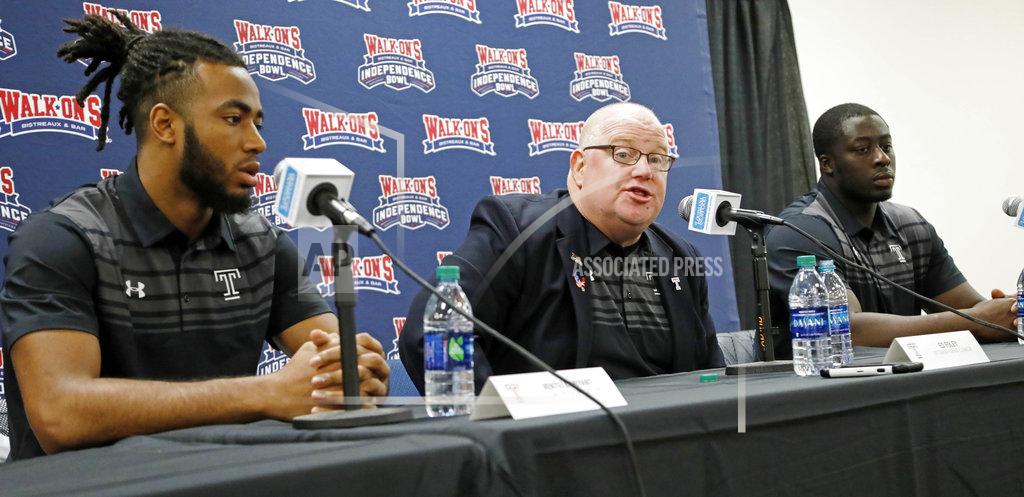Rogelio V. Solis Temple interim football coach Ed Foley, center, discusses the strengths of their opponents, Duke, while wide receiver Ventell Bryant, left, and defensive tackle Michael Dogbe, right, listen, at the 2018 Independence Bowl news conference in Shreveport, La., Wednesday, Dec. 26, 2018. Temple faces Duke in the NCAA college football game Thursday. (Rogelio V. Solis/AP)