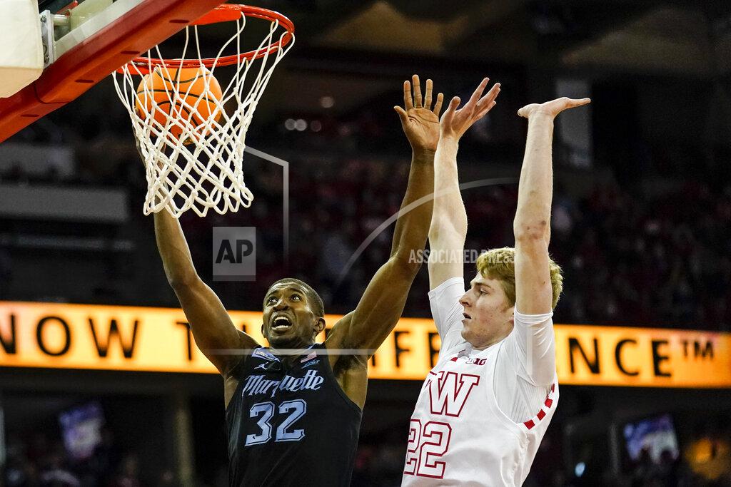 Andy Manis Marquette's Darryl Morsell (32) shoots against Wisconsin's Steven Crowl (22) during the first half of an NCAA college basketball game Saturday, Dec. 4, 2021, in Madison, Wis. (AP Photo/Andy Manis)