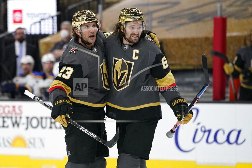John Locher Vegas Golden Knights right wing Mark Stone, right, celebrates after defenseman Alec Martinez, left, scored a goal against St. Louis Blues during the second period of an NHL hockey game Friday, May 7, 2021, in Las Vegas. (AP Photo/John Locher)