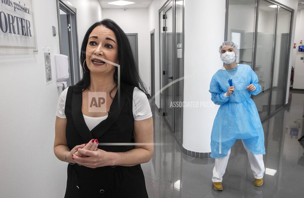 Michel Euler In this Wednesday, May 13, 2020 photo, Director Carine Benharrous of a dental office speaks during an interview with the Associated Press in Paris. Those with toothache that suffered through France's two-month lockdown, finally have hope to end the pain. Dental practices are cautiously re-opening and non-emergency dentist appointments are now permitted around the country, as the French government eased confinement restrictions from Monday. (AP Photo/Michel Euler)
