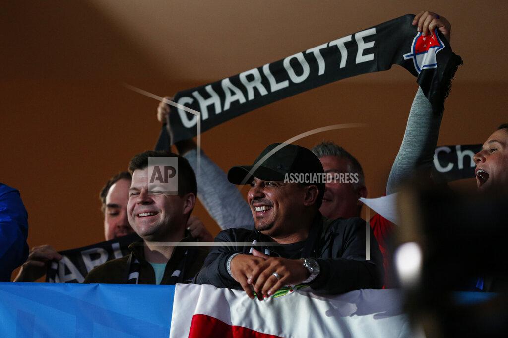 Nr Soccer fans celebrate the announcement of a Major League Soccer team, owned by David Tepper, that will begin play Charlotte in 2021 at an event in Charlotte, N.C., Tuesday, Dec. 17, 2019. (AP Photo/Nell Redmond