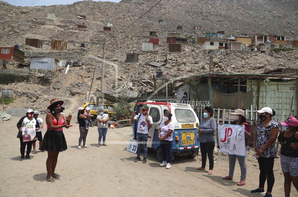 Martin Mejia In this March 27, 2021 file photo, Together for Peru transgender congressional candidate Gahela Cari, left front, claps as she campaigns in her second run for Congress, in the Casachacra shanty town on the outskirts of Lima, Peru. Two previous attempts from other trans women a decade ago failed to win enough votes. Cari is running for a seat for the second time and if she wins will become the first transgender representative in Peru’s Congress. (AP Photo/Martin Mejia, File)