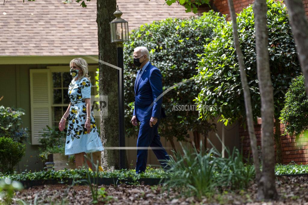 Evan Vucci President Joe Biden and first lady Jill Biden leave the home of former President Jimmy Carter during a trip to mark Biden’s 100th day in office, Thursday, April 29, 2021, in Plains, Ga. (AP Photo/Evan Vucci)