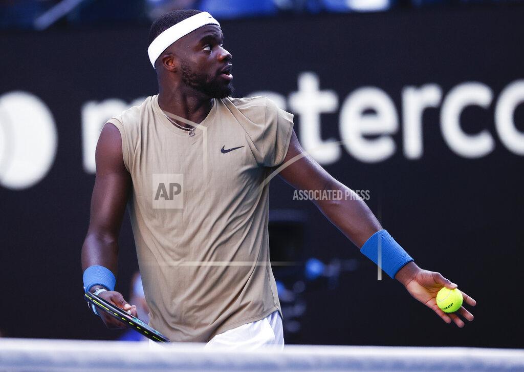 Rick Rycroft United States' Frances Tiafoe reacts as he argues with the chair umpire over a time violation while serving to Serbia's Novak Djokovic during their second round match at the Australian Open tennis championship in Melbourne, Australia, Wednesday, Feb. 10, 2021. Eliminating all line judges and removing the human element from officiating at the Australian Open might have been a necessary step to reduce the number of people on court amid a pandemic. It also might be good for the integrity of the game, because getting every call right matters so much to players and fans. (AP Photo/Rick Rycroft)