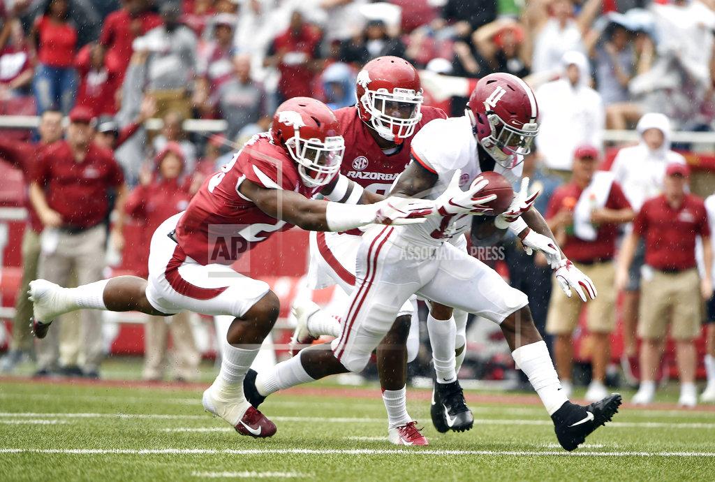 Michael Woods Alabama receiver Henry Ruggs III scoops up a fumble in front of Arkansas defenders Kamren Curl (2) and Dre Greenlaw (23) on his way to scoring a touchdown in the first half of an NCAA college football game Saturday, Oct. 6, 2018, in Fayetteville, Ark. (AP Photo/Michael Woods)