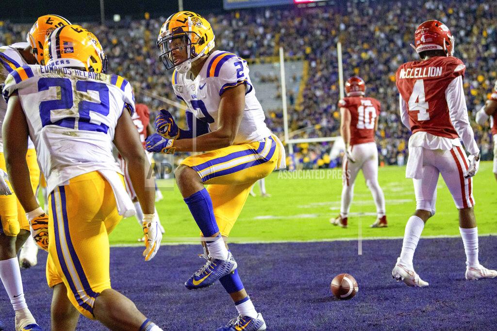 Matthew Hinton LSU wide receiver Justin Jefferson (2) celebrates a touchdown against Arkansas during the first half of an NCAA college football game in Baton Rouge, La., Saturday, Nov. 23, 2019. (AP Photo/Matthew Hinton)