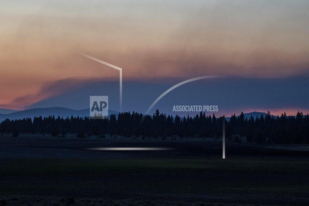 Nathan Howard Smoke rises from the Bootleg Fire on Wednesday, July 21, 2021 near Bly, Ore. (AP Photo/Nathan Howard)