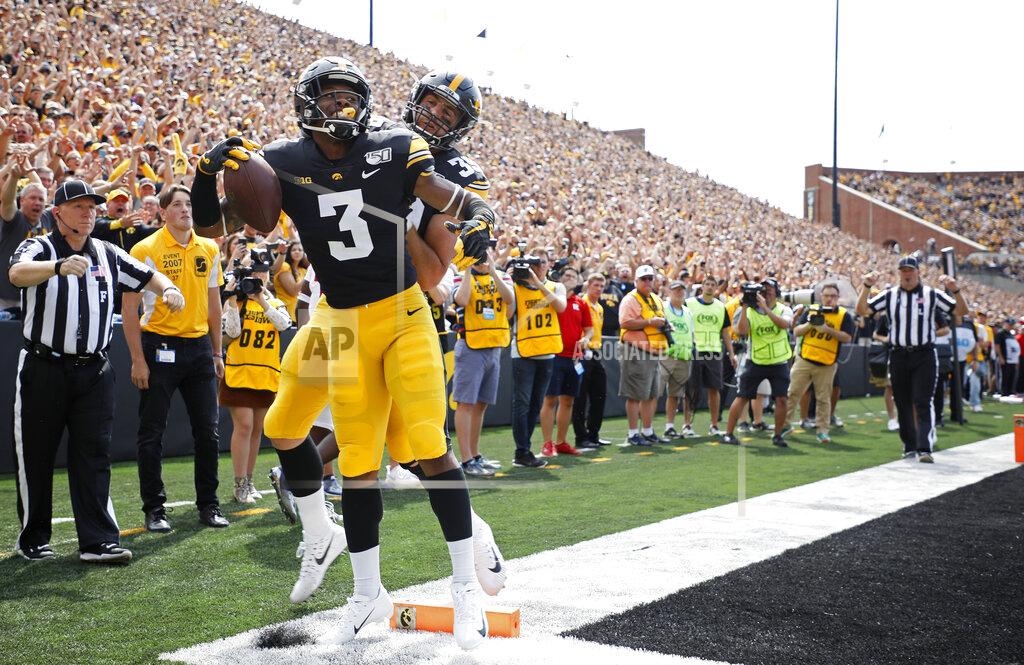 Matthew Putney Iowa wide receiver Tyrone Tracy, left, celebrates his touchdown reception with Iowa tight end Nate Wieting, right, during the first half of an NCAA college football game against Rutgers, Saturday, Sept. 7, 2019, in Iowa City. (AP Photo/Matthew Putney)