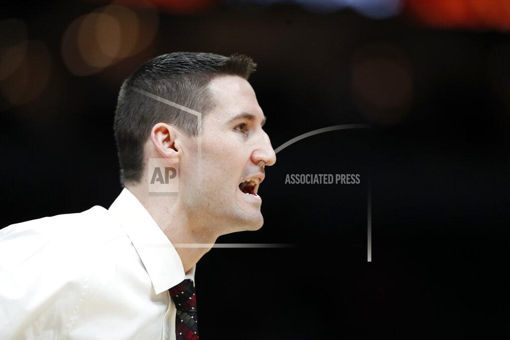 Jeff Roberson Southern Illinois head coach Bryan Mullins is seen on the sidelines during the first half of an NCAA college basketball game against Bradley in the quarterfinal round of the Missouri Valley Conference men's tournament Friday, March 6, 2020, in St. Louis. (AP Photo/Jeff Roberson)