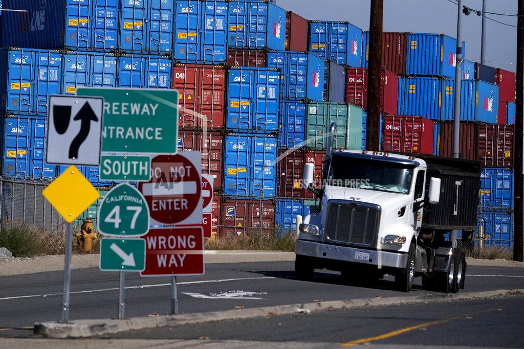 Ringo H.W. Chiu Cargo containers sit stacked at the Port of Los Angeles, Wednesday Oct. 20, 2021 in San Pedro, Calif. California Gov. Gavin Newsom on Wednesday issued an order that aims to ease bottlenecks at the ports of Los Angeles and Long Beach that have spilled over into neighborhoods where cargo trucks are clogging residential streets. (AP Photo/Ringo H.W. Chiu)
