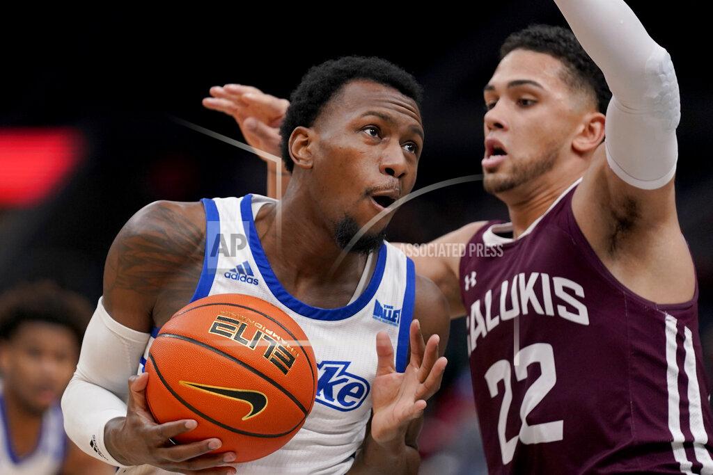 Jeff Roberson Drake's ShanQuan Hemphill, left, heads to the basket as Southern Illinois' Steven Verplancken Jr. (22) defends during the first half of an NCAA college basketball game in the quarterfinal round of the Missouri Valley Conference tournament Friday, March 4, 2022, in St. Louis. (AP Photo/Jeff Roberson)
