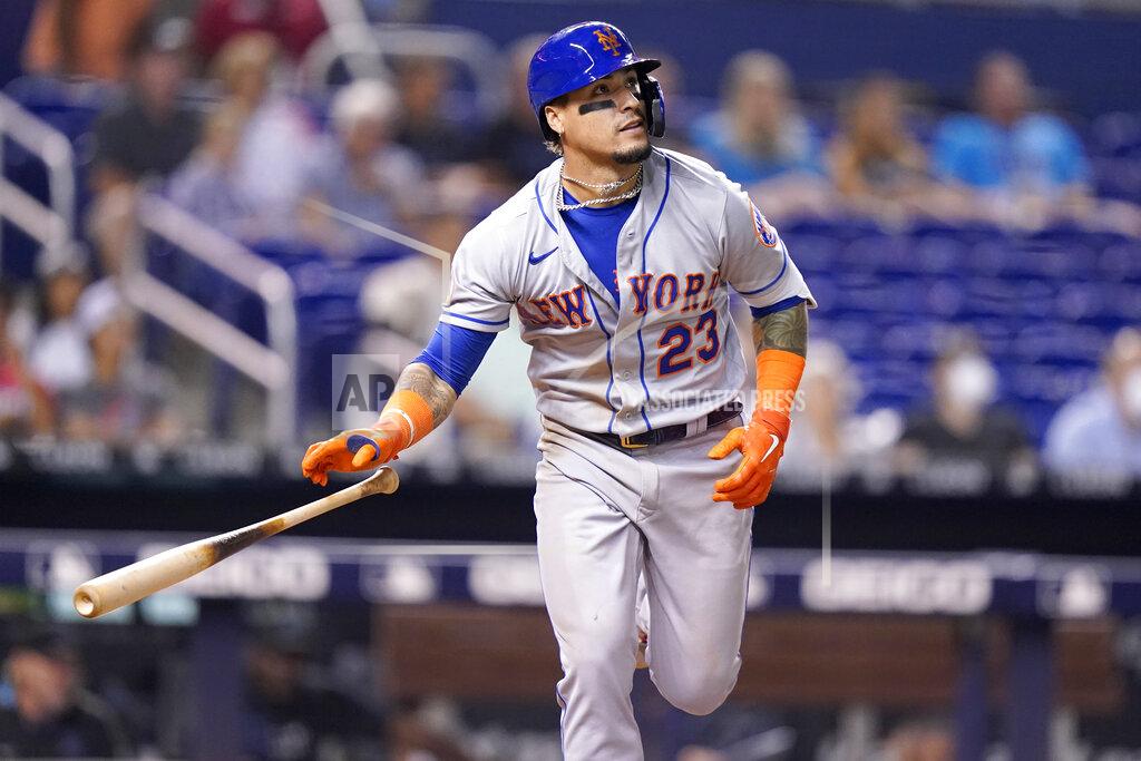 Lynne Sladky New York Mets' Javier Baez (23) watches after hitting as solo home run during the eighth inning of a baseball game against the Miami Marlins, Wednesday, Aug. 4, 2021, in Miami. The Mets won 5-3. (AP Photo/Lynne Sladky)