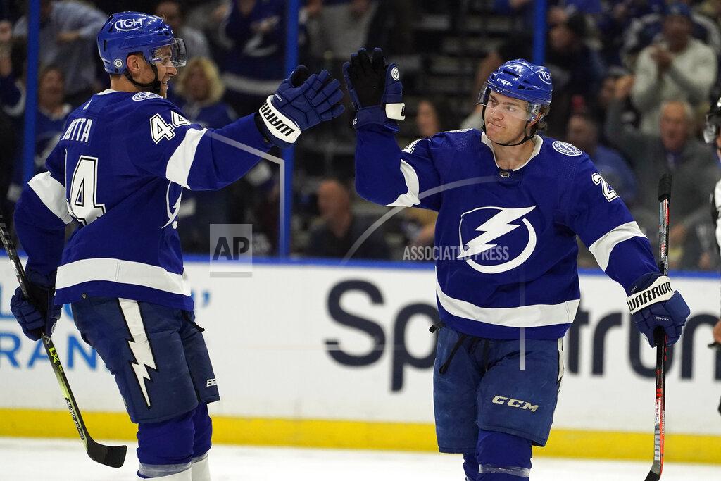 Chris O'MEara Tampa Bay Lightning center Brayden Point (21) celebrates his goal against the Florida Panthers with defenseman Jan Rutta (44) during the third period of an NHL hockey game Tuesday, Oct. 19, 2021, in Tampa, Fla. (AP Photo/Chris O'Meara)
