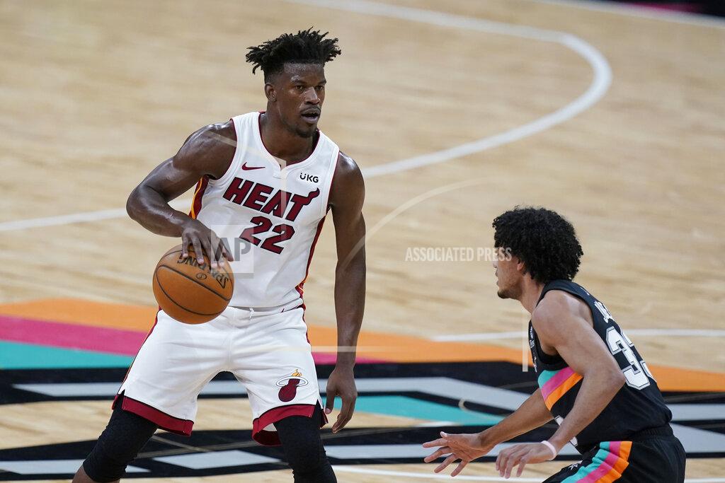 Eric Gay Miami Heat forward Jimmy Butler (22) drives around San Antonio Spurs guard Tre Jones (33) during the second half of an NBA basketball game in San Antonio, Wednesday, April 21, 2021. (AP Photo/Eric Gay)