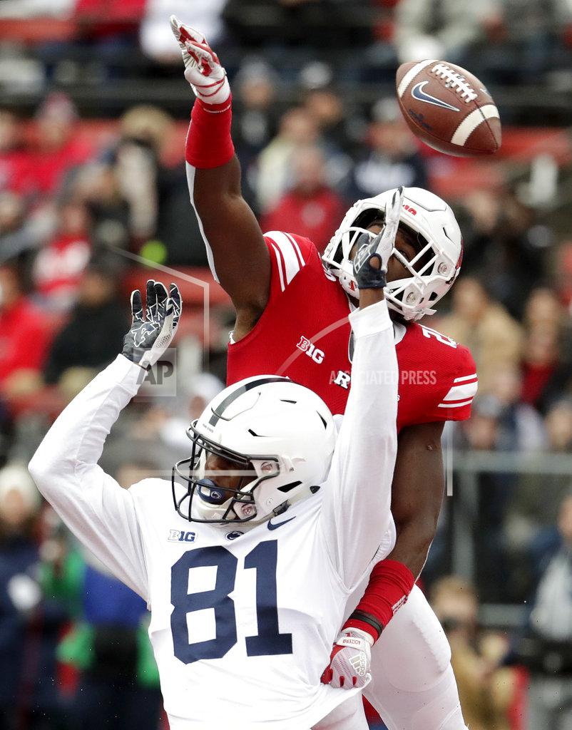 Julio Cortez Rutgers defensive back Avery Young, top, tries to deflect a pass from Penn State quarterback Trace McSorley, not pictured, intended for wide receiver Cam Sullivan-Brown during the first half of an NCAA college football game, Saturday, Nov. 17, 2018, in Piscataway, N.J. Young was called for a pass interference penalty on the play. (AP Photo/Julio Cortez)
