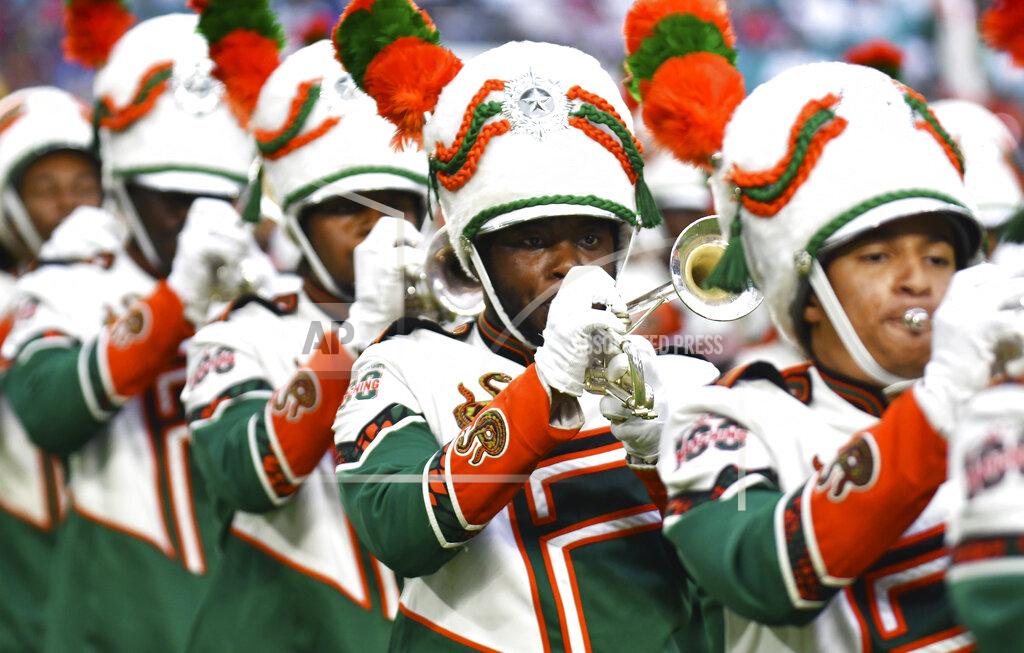 Jim Rassol The Florida A&M Marching 100 perform during halftime of an NCAA college football game against Jackson State, Sunday, Sept. 5, 2021, in Miami Gardens, Fla. (AP Photo/Jim Rassol)