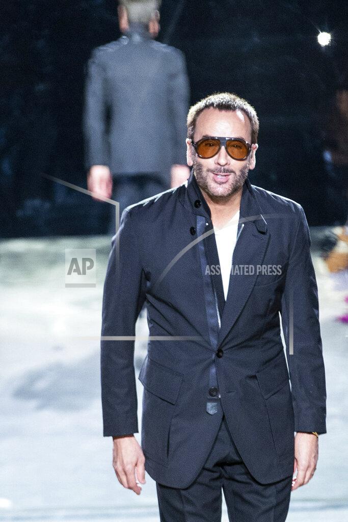 Eduardo Munoz Alvarez Designer Tom Ford walks the runway at the end of his spring/summer 2022 fashion show at Lincoln Center during New York Fashion Week on Sunday, Sept. 12, 2021. (AP Photo/Eduardo Munoz Alvarez)