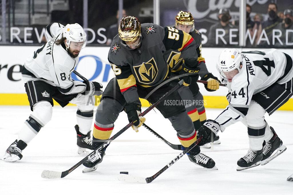 John Locher Vegas Golden Knights right wing Keegan Kolesar (55) vies for the puck with Los Angeles Kings defenseman Mikey Anderson (44) and defenseman Drew Doughty (8) during the second period of an NHL hockey game Monday, March 29, 2021, in Las Vegas. (AP Photo/John Locher)