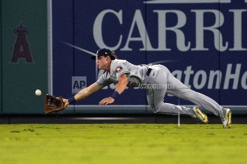 Mark J. Terrill Houston Astros center fielder Jake Meyers attempts to make a catch on a ball hit by Los Angeles Angels' Brandon Marsh during the third inning of a baseball game Wednesday, Sept. 22, 2021, in Anaheim, Calif. Marsh was safe at first on the play. (AP Photo/Mark J. Terrill)