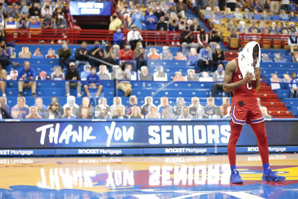 Evert Nelson Kansas guard Marcus Garrett reacts while talking about his upbringing during a special ceremony following an NCAA college basketball game against Baylor in Lawrence, Kan., Saturday, Feb. 27, 2021. (Evert Nelson/The Topeka Capital-Journal via AP)
