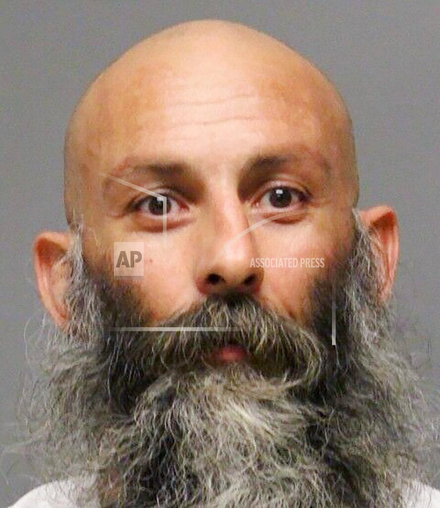 Uncredited This booking photo provided by the Delaware Department of Justice shows Barry Croft. Croft is one of several people charged with plotting to kidnap Michigan Democratic Gov. Gretchen Whitmer, authorities said Thursday, Oct. 8, 2020, in announcing charges in an alleged scheme that involved months of planning and even rehearsals to snatch Whitmer from her vacation home. (Delaware Department of Justice via AP)