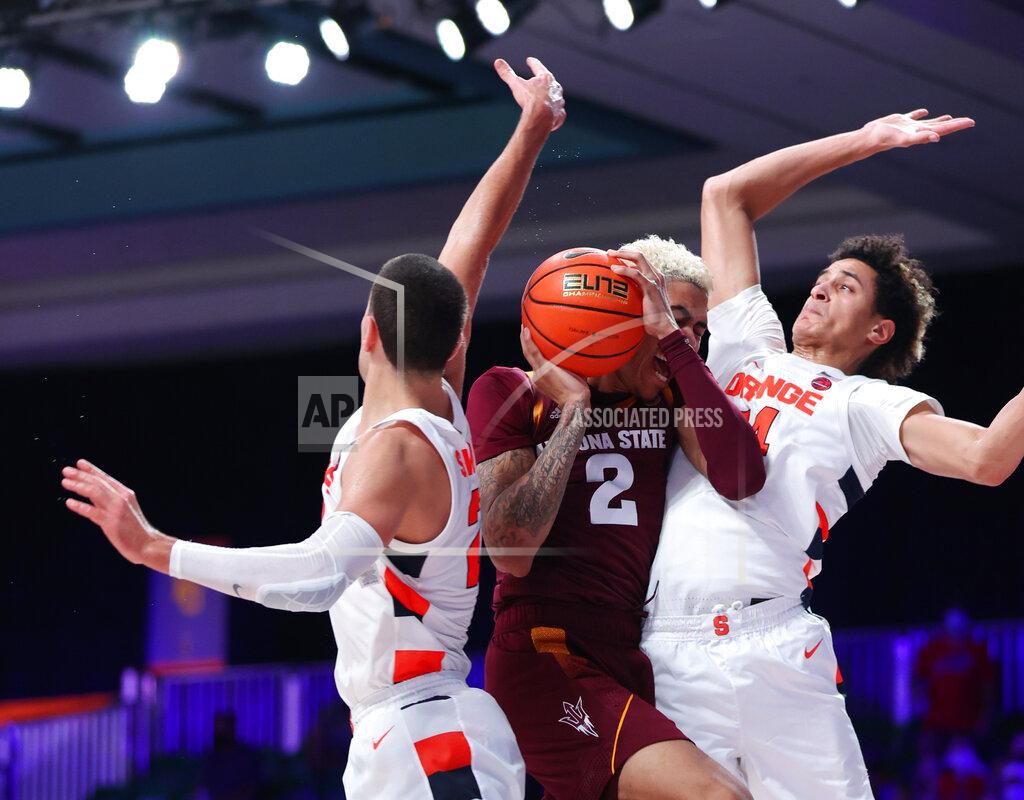 Tim Aylen In a photo provided by Bahamas Visual Services, Arizona State forward Jalen Graham (2) works between Syracuse defenders Cole Swider, left, and Jesse Edwards during an NCAA college basketball game at Paradise Island, Bahamas, Thursday, Nov. 25, 2021. (Tim Aylen/Bahamas Visual Services via AP)
