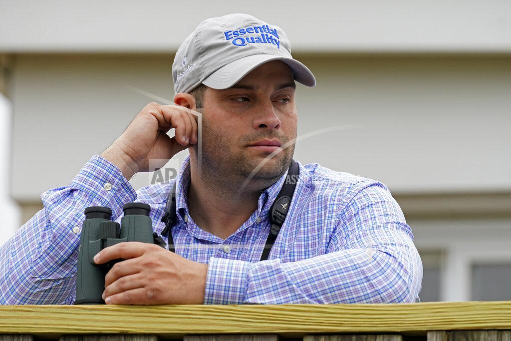 Charlie Riedel Brad Cox, trainer for Kentucky Derby entrant Essential Quality, watches a workout at Churchill Downs Thursday, April 29, 2021, in Louisville, Ky. The 147th running of the Kentucky Derby is scheduled for Saturday, May 1. (AP Photo/Charlie Riedel)