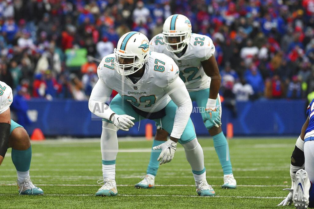 Rich Barnes FILE - In this Dec. 17, 2017, file photo, Miami Dolphins offensive tackle Laremy Tunsil (67) lines up against the Buffalo Bills during the second half of an NFL football game in Orchard Park, N.Y. The Houston Texans added six players in four trades this weekend, which included a deal that got Tunsil and receiver Kenny Stills from Miami. (AP Photo/Rich Barnes, File)