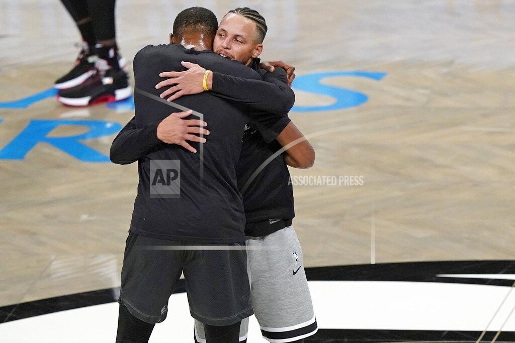 Kathy Willens Golden State Warriors guard Stephen Curry, right, embraces Brooklyn Nets forward Kevin Durant during pregame warmups before the start of an opening night NBA basketball game between the Warriors and the Nets, Tuesday, Dec. 22, 2020, in New York. (AP Photo/Kathy Willens)