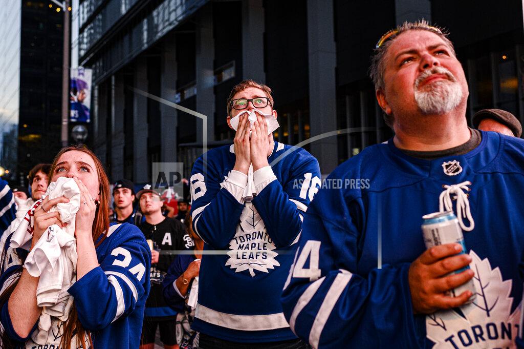 Christopher Katsarov Fans react during Game 7 of an NHL hockey first-round playoff series between the Toronto Maple Leafs and the Tampa Bay Lightning in Toronto, Saturday May 14, 2022. (Christopher Katsarov/The Canadian Press via AP)