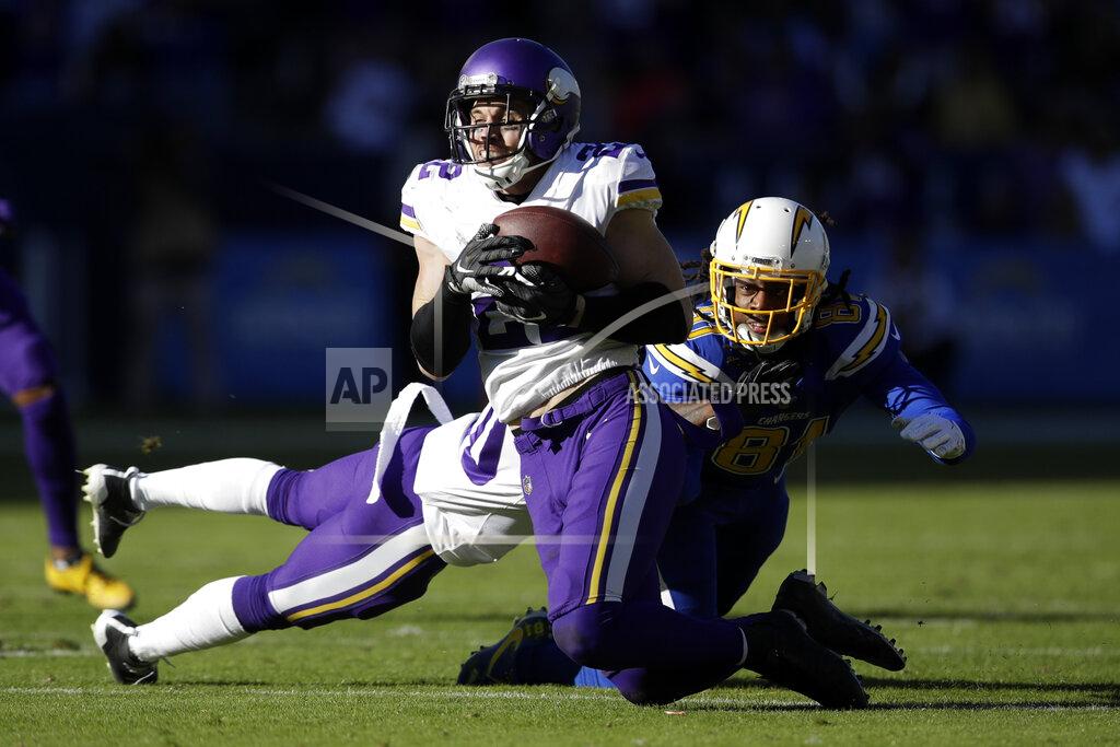 Marcio Jose Sanchez Minnesota Vikings free safety Harrison Smith , front,intercepts a pass intended for Los Angeles Chargers wide receiver Mike Williams, right, during the first half of an NFL football game Sunday, Dec. 15, 2019, in Carson, Calif. (AP Photo/Marcio Jose Sanchez)